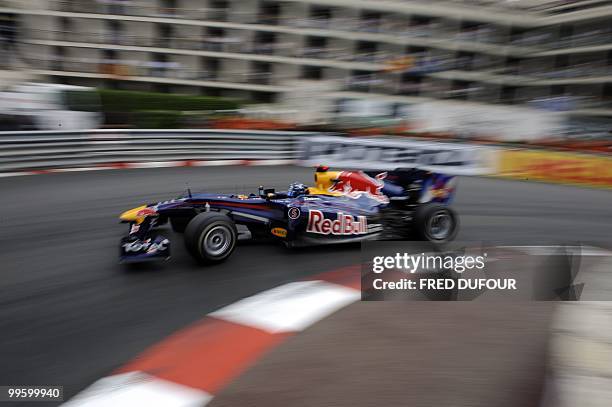 Red Bull's German driver Sebastian Vettel drives at the Monaco street circuit on May 16 during the Monaco Formula One Grand Prix. AFP PHOTO / FRED...