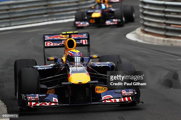Mark Webber of Australia and Red Bull Racing leads from team mate Sebastian Vettel of Germany and Red Bull Racing on his way to winning the Monaco...