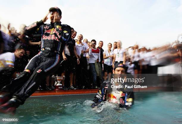 Race winner Mark Webber of Australia and Red Bull Racing celebrates with second placed Sebastian Vettel of Germany and Red Bull Racing in the Red...