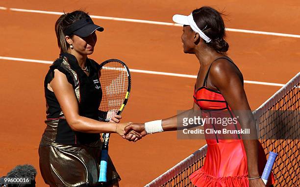Aravane Rezai of France shakes hands at the net after her straight sets victory against Venus Williams of the USA in the womens final match during...