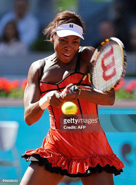 Venus Williams returns a ball to French Aravane Rezai during their final match of the Madrid Masters on May 16, 2010 at the Caja Magic sports complex...