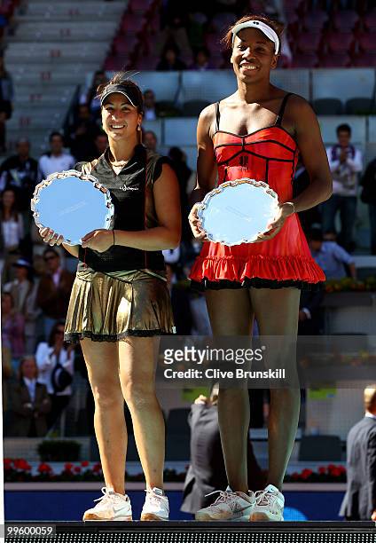Womens finalists Aravane Rezai of France and Venus Williams of the USA hold their trophies after the womens final match during the Mutua Madrilena...