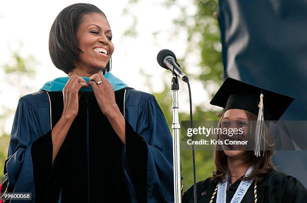 First lady Michelle Obama recieves a honorary doctorate in Public Service during the 2010 George Washington University commencement at the National...