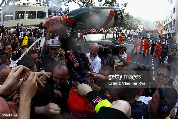 Mark Webber of Australia and Red Bull Racing celebrates with team mates after winning the Monaco Formula One Grand Prix at the Monte Carlo Circuit on...