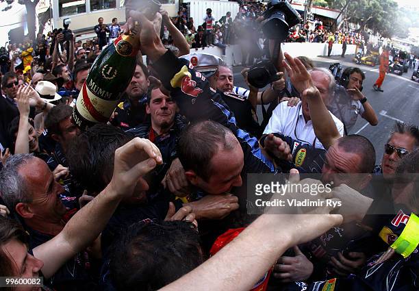 Mark Webber of Australia and Red Bull Racing celebrates with team mates after winning the Monaco Formula One Grand Prix at the Monte Carlo Circuit on...
