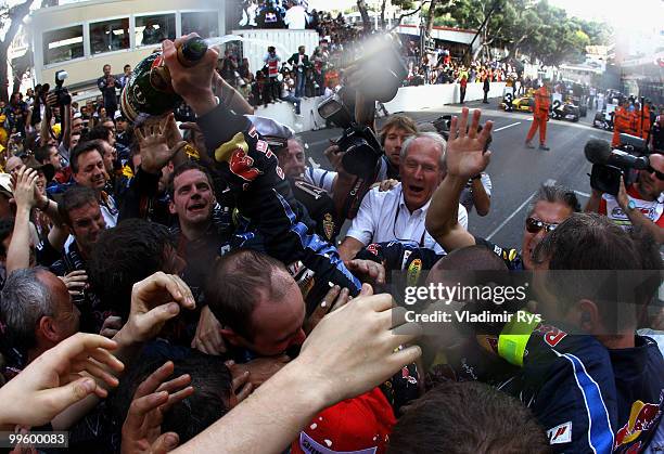 Mark Webber of Australia and Red Bull Racing celebrates with team mates after winning the Monaco Formula One Grand Prix at the Monte Carlo Circuit on...