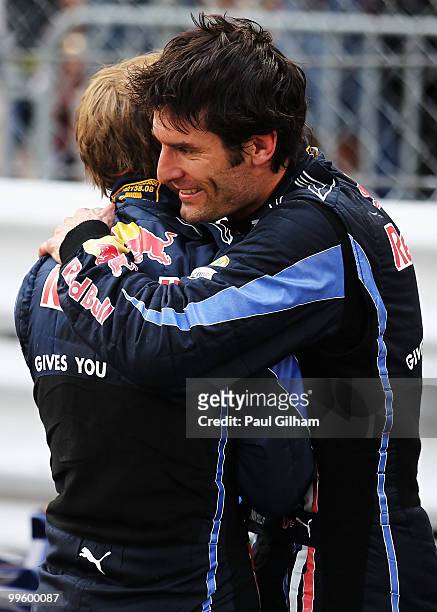 Race winner Mark Webber of Australia and Red Bull Racing celebrates with second placed team mate Sebastian Vettel of Germany and Red Bull Racing...