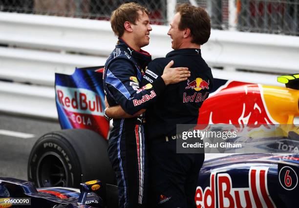 Red Bull Racing Team Principal Christian Horner congratulates second placed Sebastian Vettel of Germany and Red Bull Racing following the Monaco...