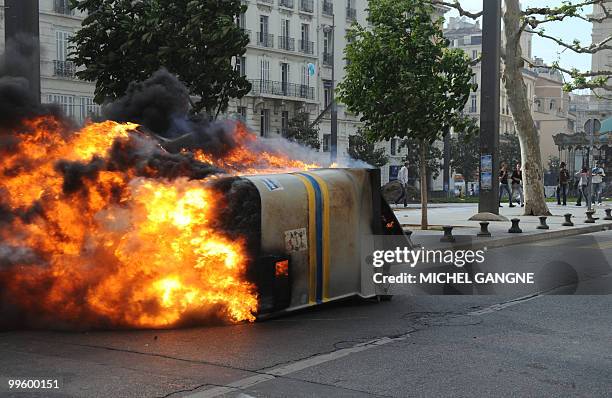 Dustbin burns on May 16, 2010 in Marseille southern France during a street clash that broke out after Olympique de Marseille's players paraded in the...
