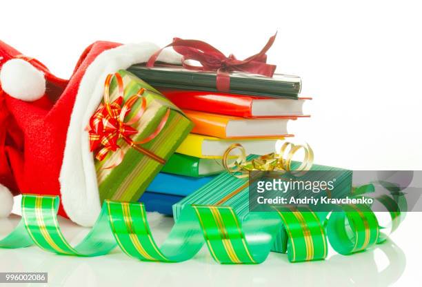 christmas presents with e-book reader and books in bag against white background - e reader - fotografias e filmes do acervo