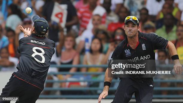 England cricketer Stuart Broad watched by teammate Michael Lumb takes a catch of Australian cricketer Cameron White during the Men's ICC World...