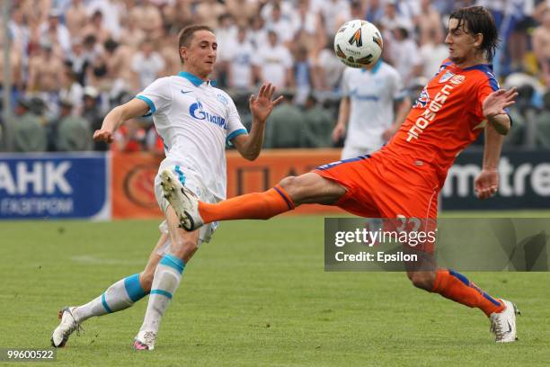 Vladimir Bystrov of FC Zenit St. Petersburg battles for the ball with Egor Filipenko of FC Sibir Novosibirsk during the Russian Cup final match...