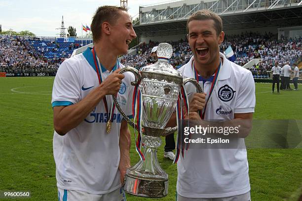 Vladimir Bystrov and Aleksandr Kerzhakov of FC Zenit St. Petersburg celebrate with the trophy at the end of the Russian Cup final match between FC...