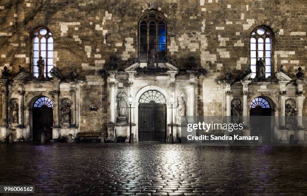 church entrance on dumb december night in riga - kumara stock pictures, royalty-free photos & images