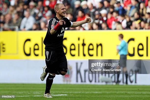 Andreas Wolf of Nuernberg celebrates his team's first goal by team mate Ilkay Guendogan during the Bundesliga play off leg two match between FC...