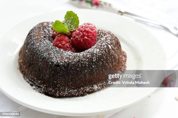 molten lava cake in heart shape - lava cake stock pictures, royalty-free photos & images