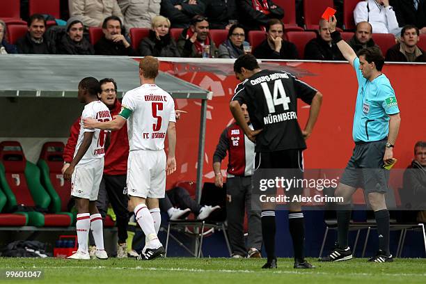Ibrahima Traore of Augsburg is sent off by referee Manuel Graefe during the Bundesliga play off leg two match between FC Augsburg and 1. FC Nuernberg...