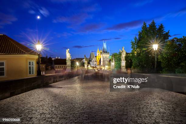 night scene view of st. nicholas church and lesser town bridge tower and castle, view from charles bridge, where is the famous landmark for travel by tourist in prague or praha, czech republic, europe - st nicholas church stock pictures, royalty-free photos & images