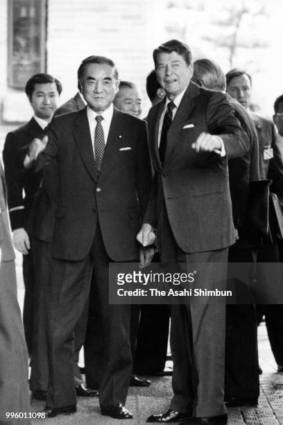 President Ronald Reagan is welcomed by Japanese Prime Minister Yasuhiro Nakasone prior to their meeting ahead of the Summit meeting at the prime...