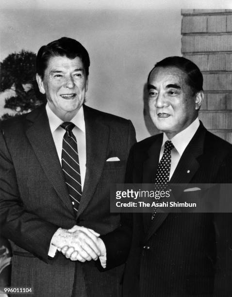 President Ronald Reagan shakes hands with Japanese Prime Minister Yasuhiro Nakasone prior to their meeting ahead of the Summit meeting at the prime...