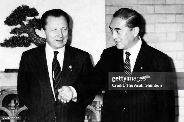 European Commission President Jacques Delors shakes hands with Japanese Prime Minister Yasuhiro Nakasone prior to their meeting ahead of the Summit...