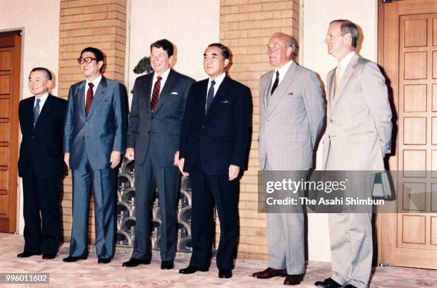 Japanese Finance Minister Noboru Takeshita, Japanese Foreign Minister Shintaro Abe, U.S. President Ronald Reagan, Japanese Prime Minister Yasuhiro...