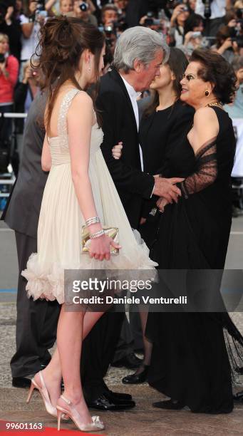 Anouchka Delon, actor Alain Delon and actress Claudia Cardinale attend the 'Il Gattopardo' premiere held at the Palais des Festivals during the 63rd...