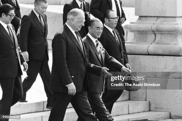 West German Chancellor Helmut Kohl attends the welcome ceremony with Japanese Prime Minister Yasuhiro Nakasone ahead of the Summit meeting at the...