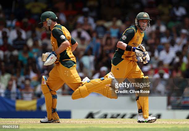 David Hussey and Michael Hussey of Australia run between the wickets during the final of the ICC World Twenty20 between Australia and England at the...