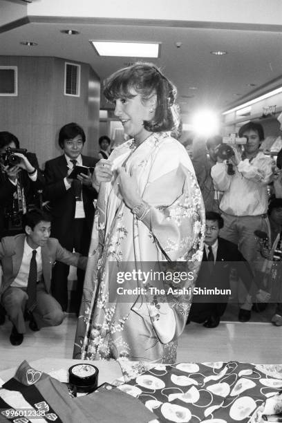 Mila Mulroney, wife of Canadian Prime Minister Brian Mulroney tries Japanese kimono during her visit to the Takashimaya Department Store on the...