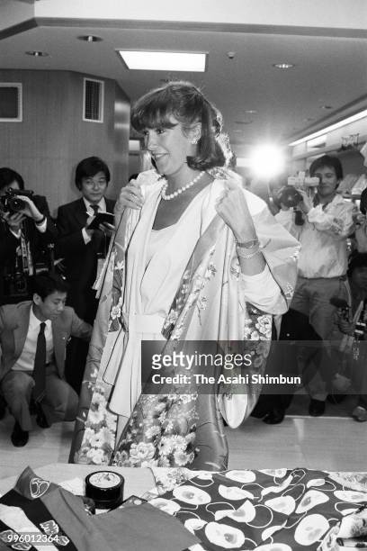 Mila Mulroney, wife of Canadian Prime Minister Brian Mulroney tries Japanese kimono during her visit to the Takashimaya Department Store on the...