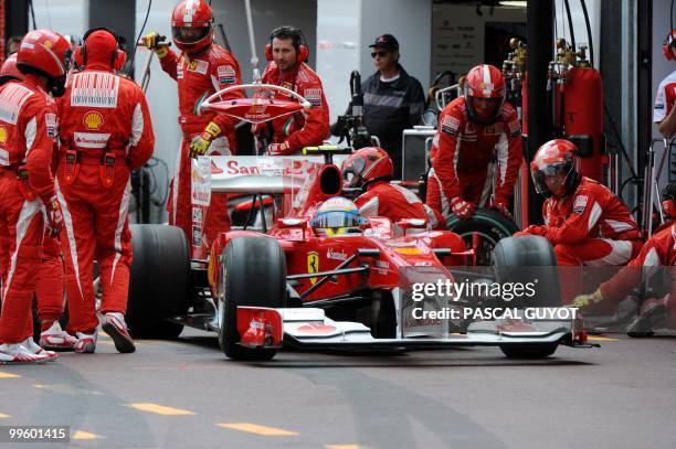 Ferrari's Spanish driver Fernando Alonso pit stops at the Monaco street circuit on May 16 during the Monaco Formula One Grand Prix. AFP PHOTO / POOL...