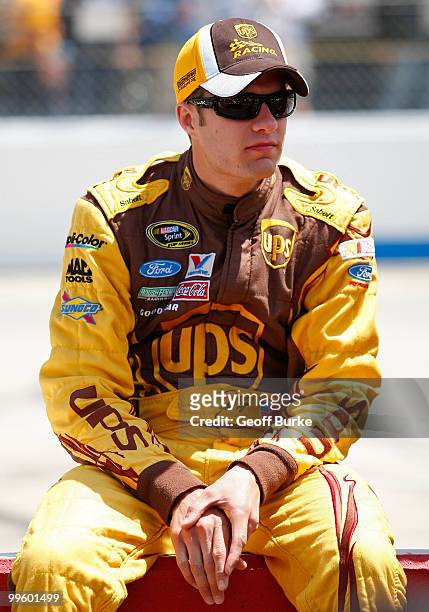David Ragan, driver of the UPS Ford, sits on the pit wall prior to the NASCAR Sprint Cup Series Autism Speaks 400 at Dover International Speedway on...