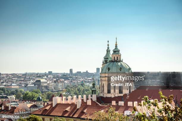 panorama of the city of prague and st nicholas church - st nicholas church stock-fotos und bilder