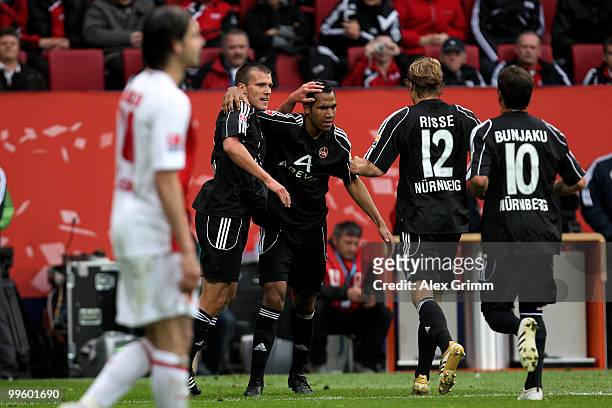 Eric-Maxim Choupo-Moting of Nuernberg celebrates his team's second goal with team mates Christian Eigler , Marcel Risse and Albert Bunjaku as Stefan...