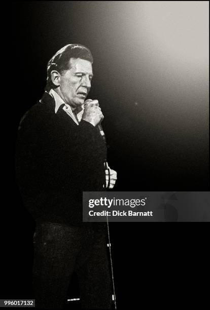 Jerry Lee Lewis performs on stage at Hammersmith Odeon, London, November 1989.