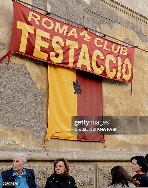 Roma supporters react at the Roma supporters' club Testaccio in Rome after their team's last season match against Chievo on May 16, 2010. Inter Milan...