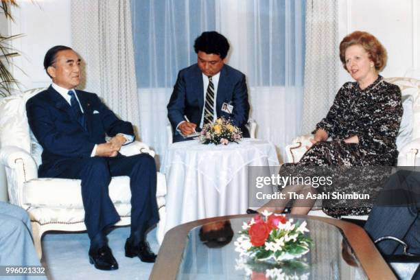 British Prime Minister Margaret Thatcher and Japanese Prime Minister Yasuhiro Nakasone talk during their bilateral meeting on the sidelines of the...