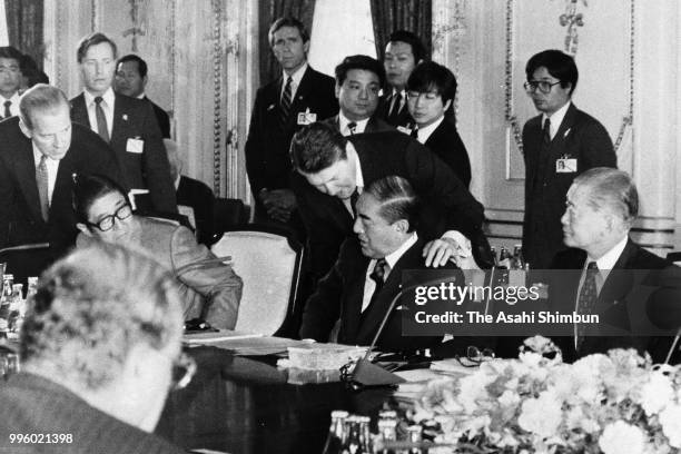 President Ronald Reagan talks to Japanese Prime Minister Yasuhiro Nakasone prior to the plenary session of the Summit meeting at the Akasaka State...