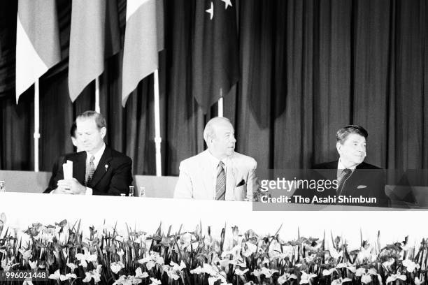 President Ronald Reagan , U.S. Secretary of State George Shultz and U.S. Secretary of Treasury James Baker attend a press conference after the Summit...