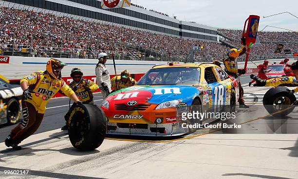 Kyle Busch, driver of the M&M's Toyota, pits during the NASCAR Sprint Cup Series Autism Speaks 400 at Dover International Speedway on May 16, 2010 in...