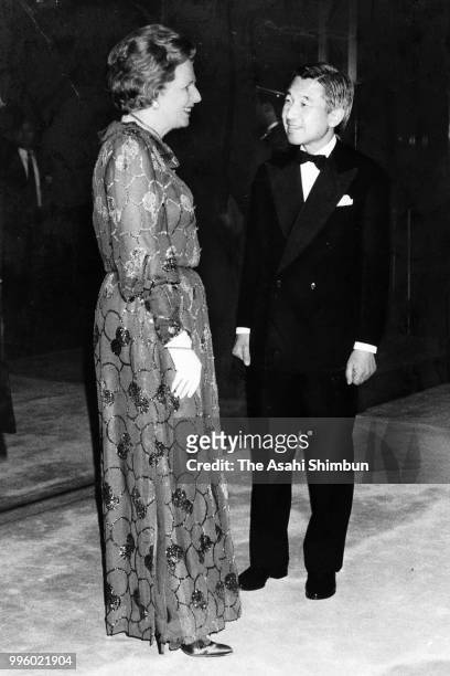 British Prime Minister Margaret Thatcher is welcomed by Crown Prince Akihito prior to the state dinner on the sidelines of the Summit meeting at the...