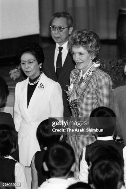 Nancy Reagan, wife of U.S. President Ronald Reagan and Tsuta Nakasone, wife of Japanese Prime Minister Yasuhiro Nakasone visit an elementary school...