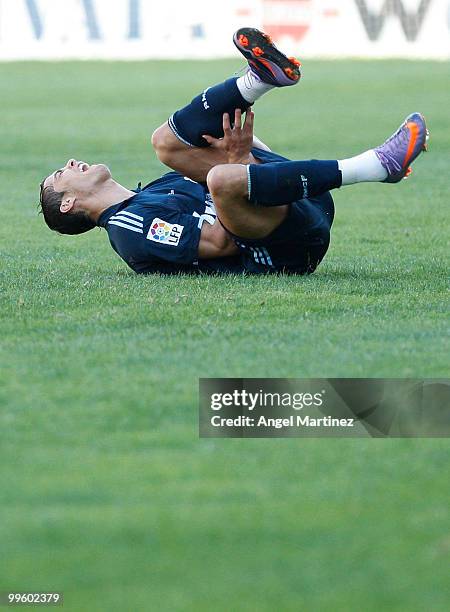 Cristiano Ronaldo of Real Madrid reacts after taking a knock during the La Liga match between Malaga and Real Madrid at La Rosaleda Stadium on May...