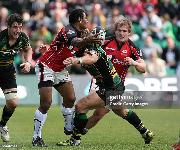 Kameli Ratuvou of Saracens offloads in the tackle during the Guinness Premiership semi final match between Northampton Saints and Saracens at...