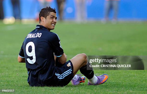 Real Madrid's Portuguese forward Cristiano Ronaldo postures during a Spanish league football match against Malaga at Rosaleda stadium on May 16,...