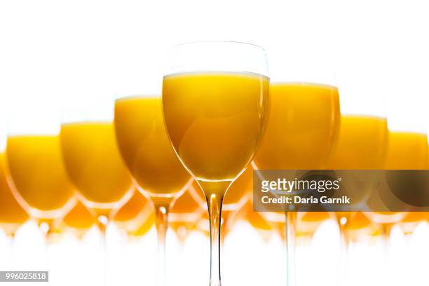 fresh orange juice. high key, white background. - orange juice glass white background stock pictures, royalty-free photos & images