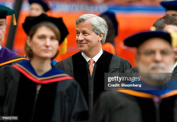 James "Jamie" Dimon, chairman and chief executive officer of JPMorgan Chase & Co., enters the Carrier Dome during Syracuse University's commencement...