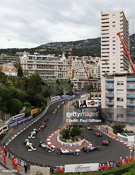 Mark Webber of Australia and Red Bull Racing leads the field round the hairpin on the first lap of the Monaco Formula One Grand Prix at the Monte...