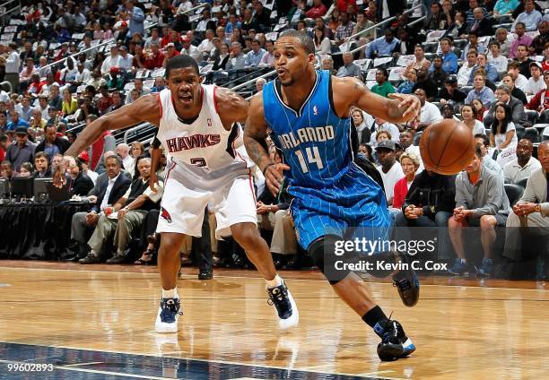 Jameer Nelson of the Orlando Magic against Joe Johnson of the Atlanta Hawks during Game Four of the Eastern Conference Semifinals of the 2010 NBA...